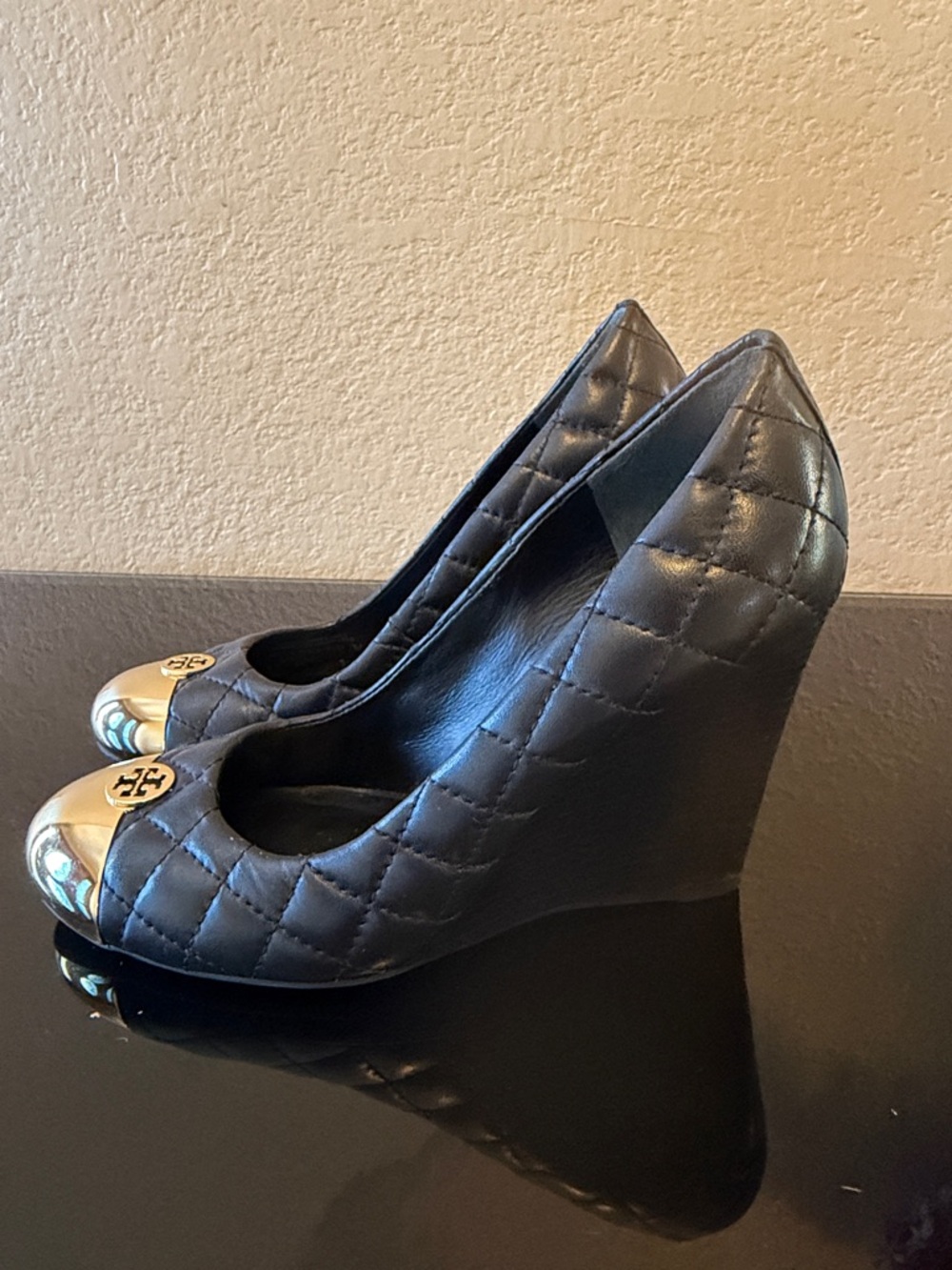 Tory Burch Black Quilted Leather Wedge Pumps with Gold Cap Toe Logo